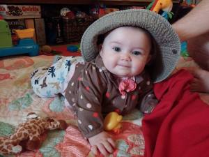 Baby Girl in daddy's hat